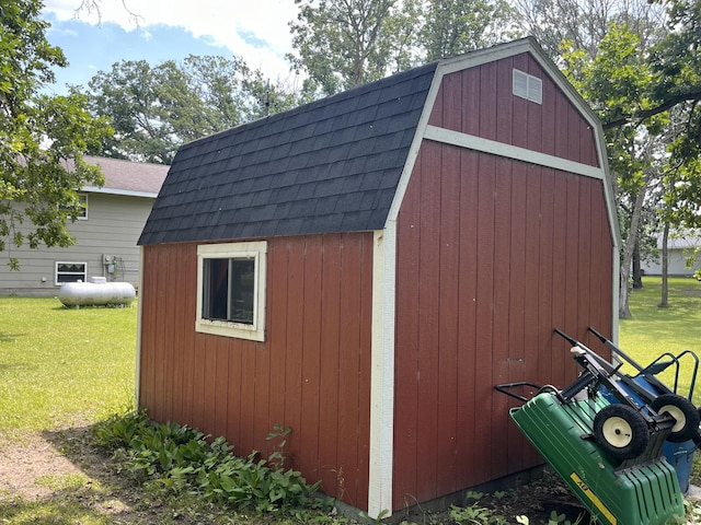 view of outdoor structure with a lawn