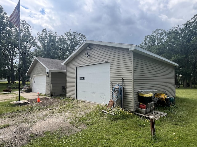 garage featuring a lawn