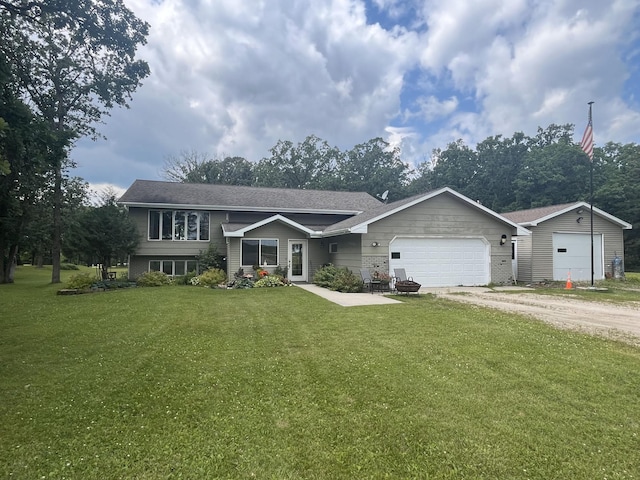 view of front of house featuring a garage and a front yard