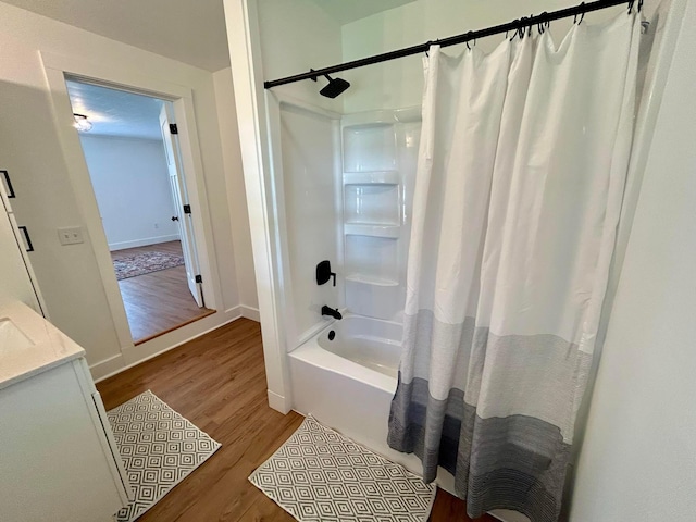 bathroom featuring shower / bath combination with curtain, vanity, and hardwood / wood-style floors