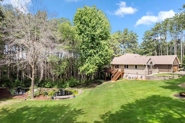 view of yard with a wooden deck