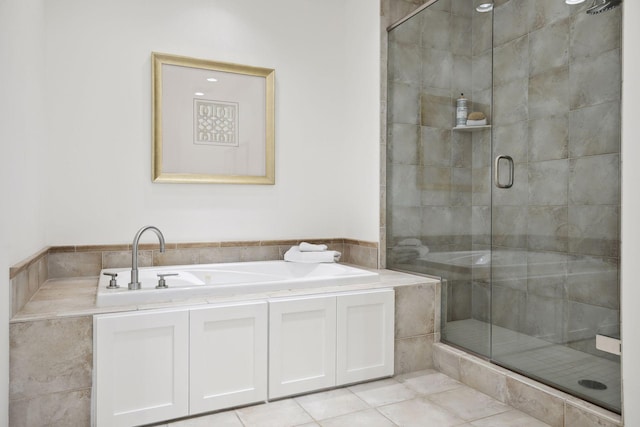 bathroom featuring a shower with shower door and tile patterned floors