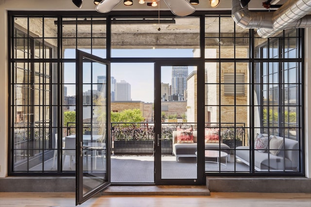 entryway featuring hardwood / wood-style floors and expansive windows