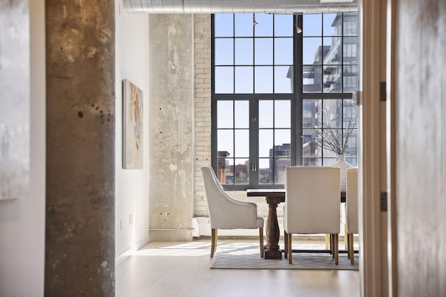 interior space with concrete flooring and french doors