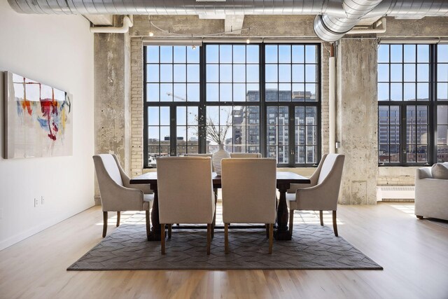 dining area with hardwood / wood-style flooring