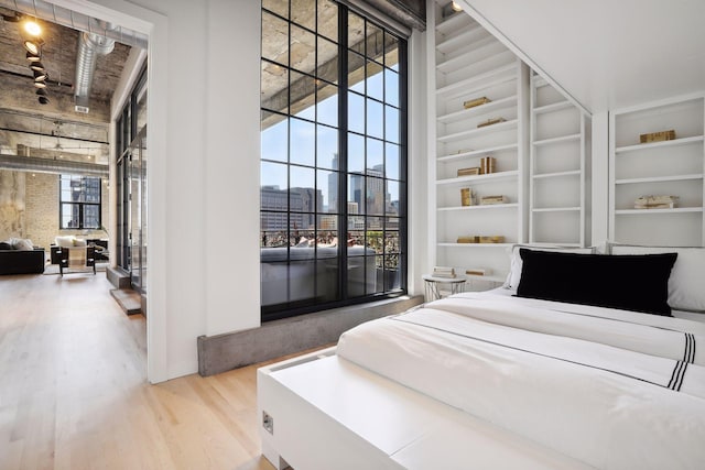 bedroom featuring hardwood / wood-style floors