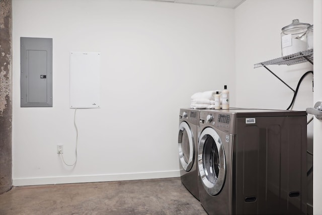 clothes washing area with independent washer and dryer and electric panel