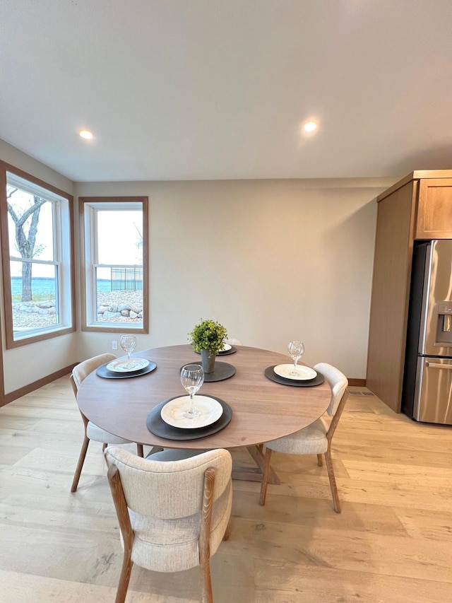 dining room featuring light wood-type flooring