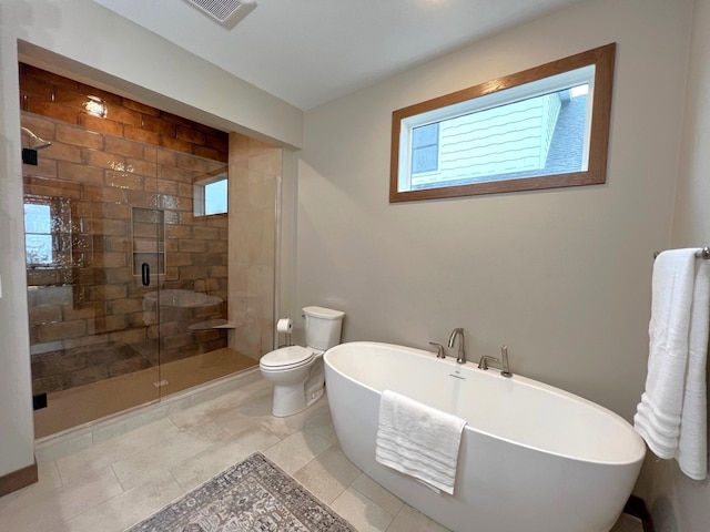 bathroom featuring shower with separate bathtub and toilet