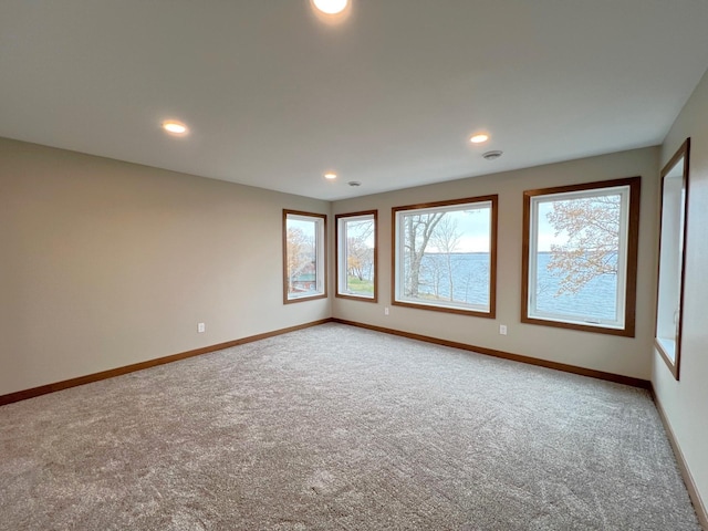 unfurnished room with carpet floors