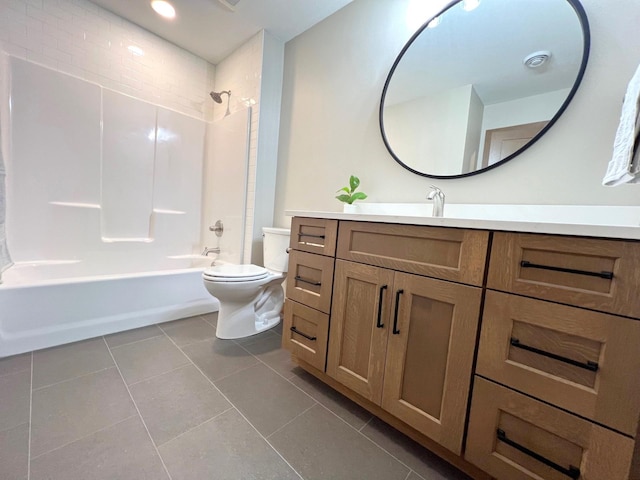 full bathroom featuring vanity, tile patterned floors,  shower combination, and toilet