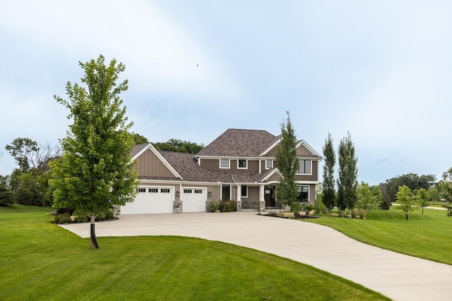 view of front of house with a garage and a front yard