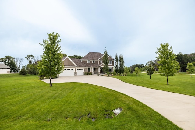 view of front of house with a garage and a front lawn