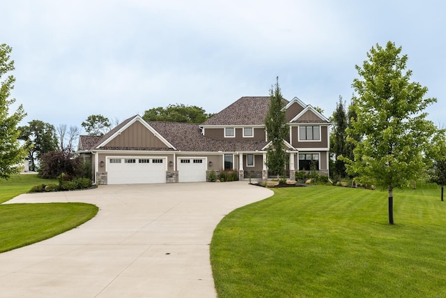 craftsman-style house featuring a garage and a front yard