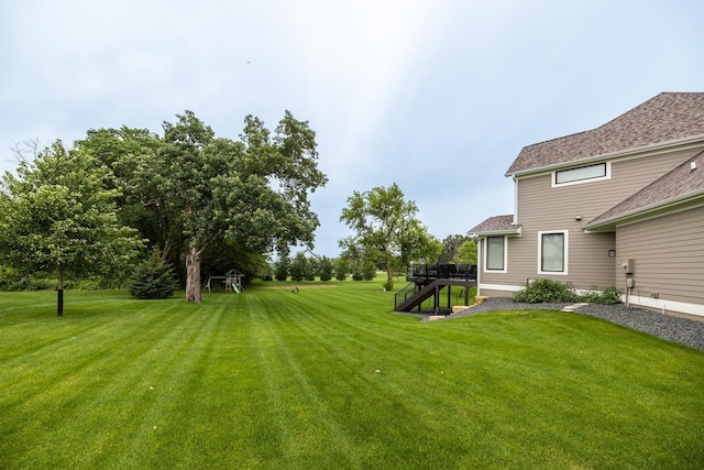 view of yard with a wooden deck