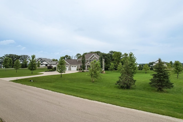 exterior space with a garage and a front yard