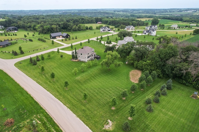 birds eye view of property with a rural view