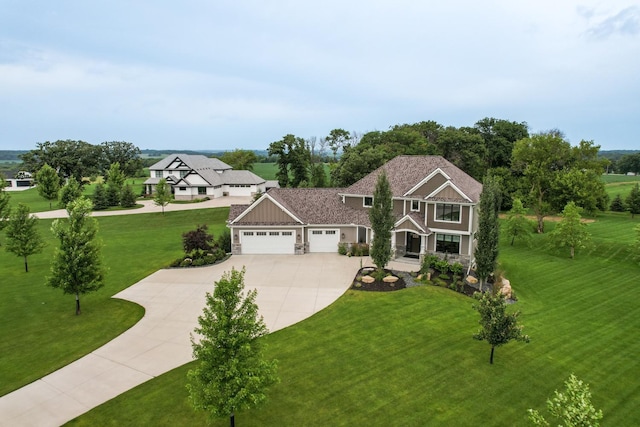 view of front of home featuring a garage and a front lawn