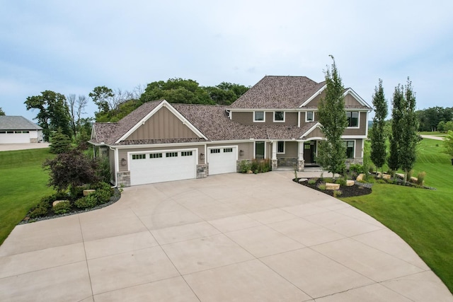 craftsman-style home with a garage and a front yard