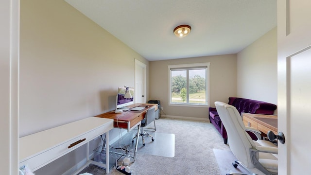 office area featuring light carpet