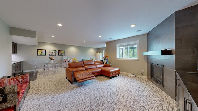 carpeted living room with a fireplace