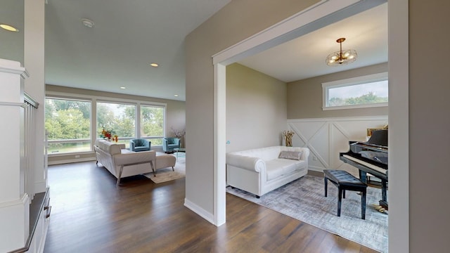 interior space featuring a notable chandelier and dark hardwood / wood-style flooring