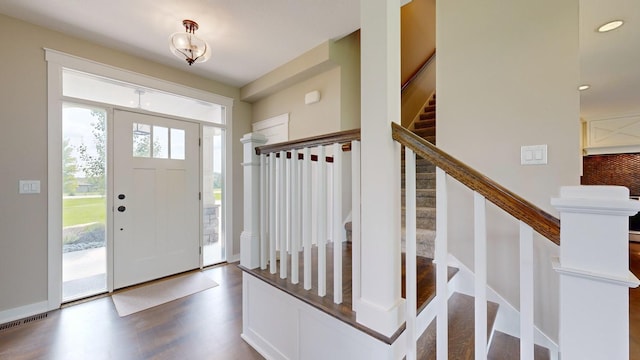 foyer entrance with dark hardwood / wood-style flooring