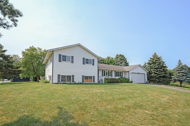 split level home featuring a garage and a front yard