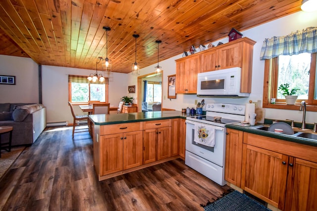 kitchen with decorative light fixtures, sink, a baseboard heating unit, kitchen peninsula, and white appliances