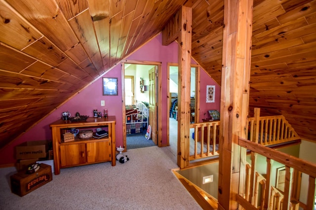 additional living space featuring light colored carpet, lofted ceiling, and wooden ceiling