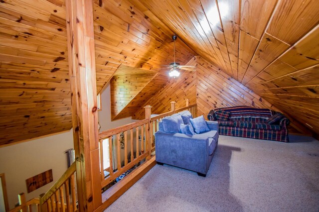 interior space with wood ceiling, wooden walls, vaulted ceiling, and carpet