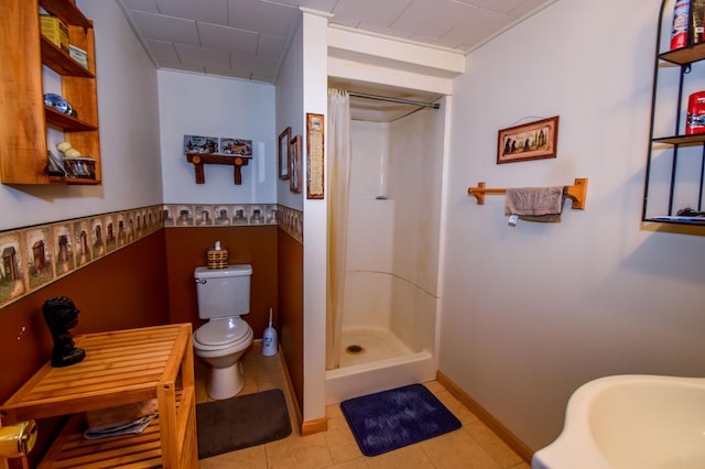 bathroom with toilet and curtained shower