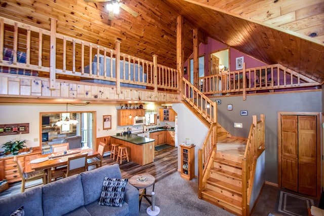 living room with ceiling fan, high vaulted ceiling, and wood ceiling