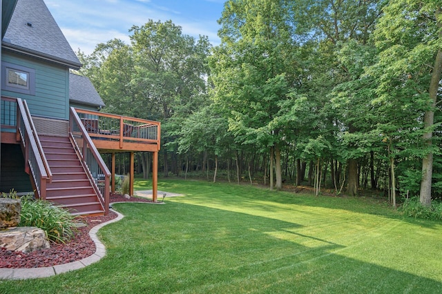 view of yard featuring stairway and a wooden deck