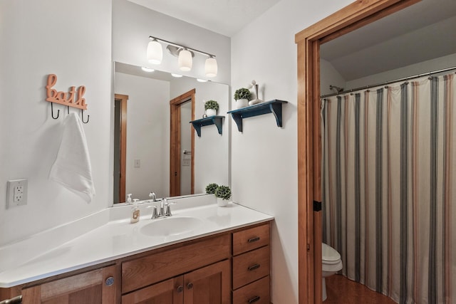 full bath featuring toilet and vanity