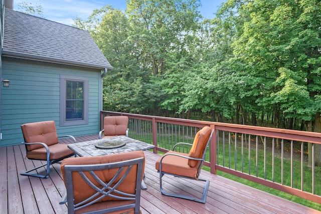 wooden terrace with a yard