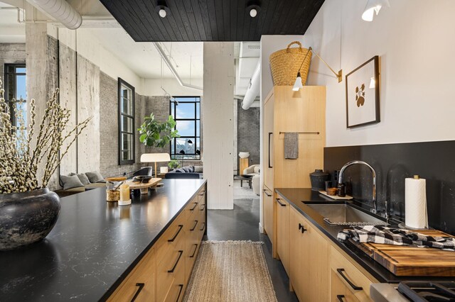 kitchen featuring sink and light brown cabinets