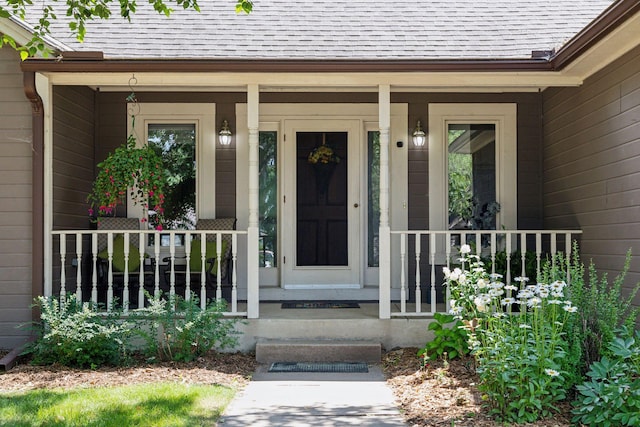 doorway to property featuring covered porch