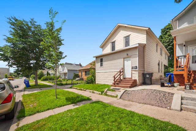 front facade with a front lawn