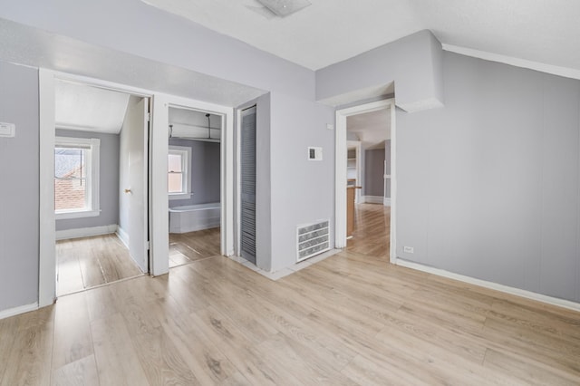 unfurnished bedroom with light hardwood / wood-style floors