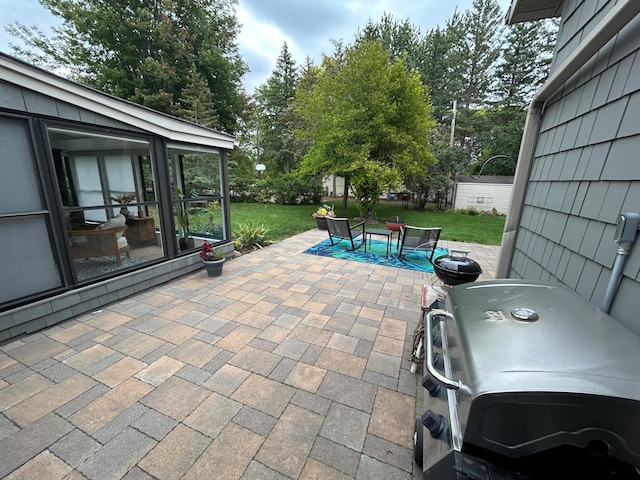 view of patio with a grill