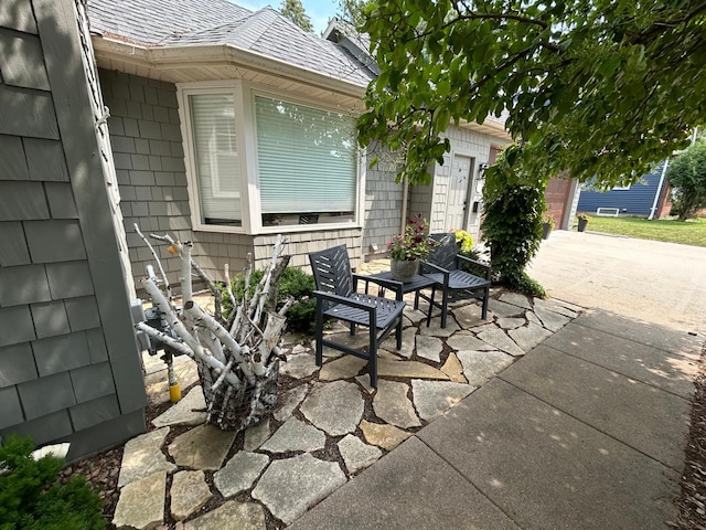 1324 Ridgeview Dr, Montevideo, MN 56265 - view of patio / terrace with a garage and concrete driveway