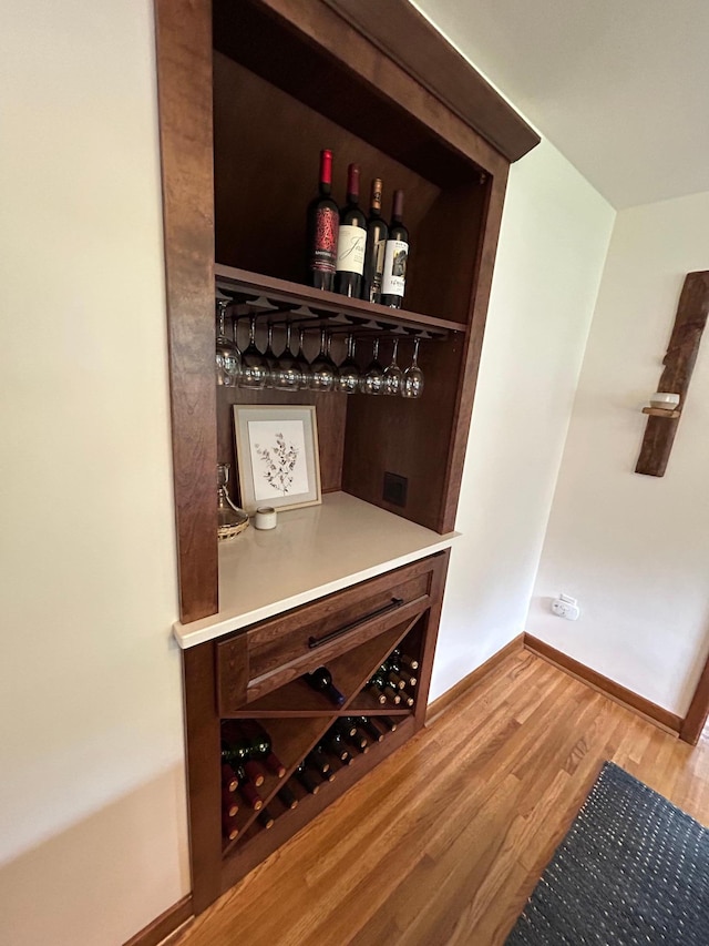 1324 Ridgeview Dr, Montevideo, MN 56265 - bar with a dry bar, baseboards, and wood finished floors