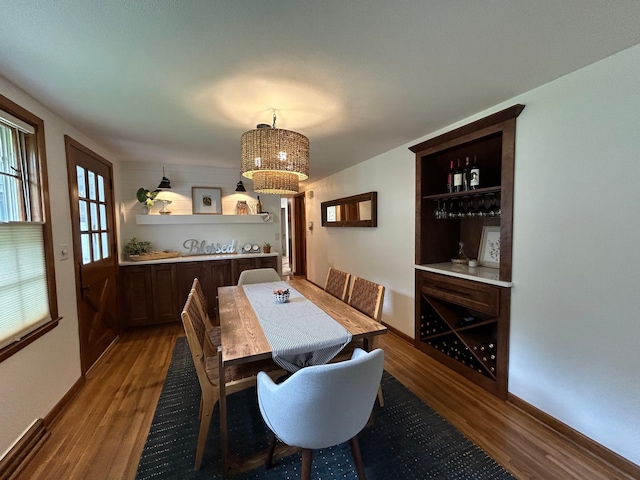 1324 Ridgeview Dr, Montevideo, MN 56265 - dining room with baseboards, an inviting chandelier, and wood finished floors