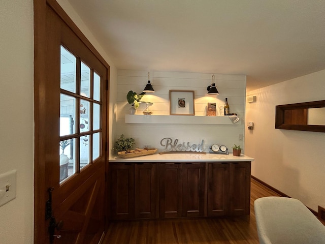 1324 Ridgeview Dr, Montevideo, MN 56265 - bar with a healthy amount of sunlight, dark wood-style floors, baseboards, and a sink
