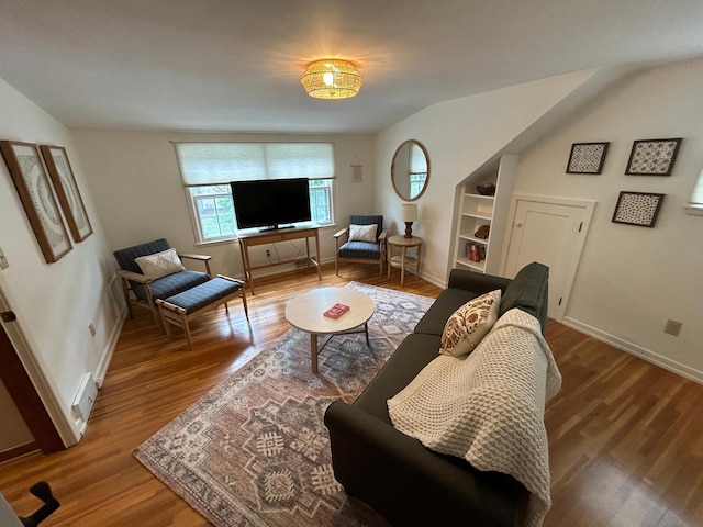 1324 Ridgeview Dr, Montevideo, MN 56265 - living area with wood finished floors, built in features, and baseboards