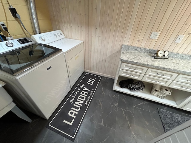 1324 Ridgeview Dr, Montevideo, MN 56265 - washroom featuring laundry area, baseboards, marble finish floor, wood walls, and washing machine and dryer
