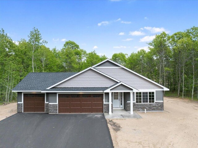 view of front of property with a garage