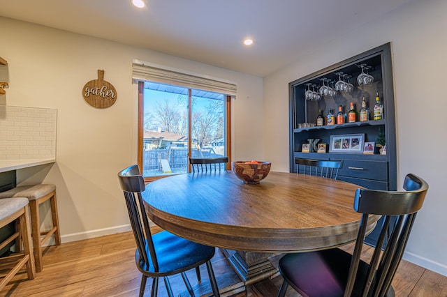 dining area with light hardwood / wood-style floors