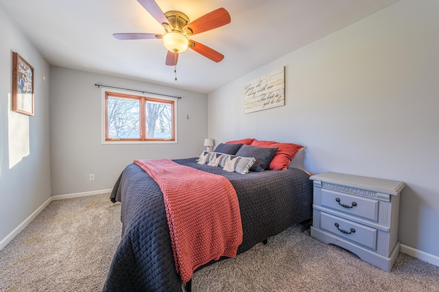 bedroom featuring light carpet and ceiling fan